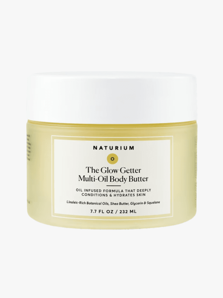 Naturium The Glow Getter Multi-Oil Body Butter in branded tub component on a light gray background